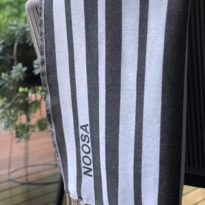 Beach towel hanging over deck chair